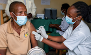 A man receives a vaccine against the coronavirus disease at the Masaka hospital in Kigali, Rwanda, on March 5 2021. 
