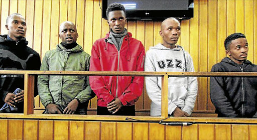 The five students arrested after the killing of Lwando Mantshontsho in the dock at Mthatha Magistrate's Court. They are, from left, Siphesihle Mafungwa, Yamkela Mxokozeli, Philani Daca, Sindile Khanga and Lwakhe Matakanye.