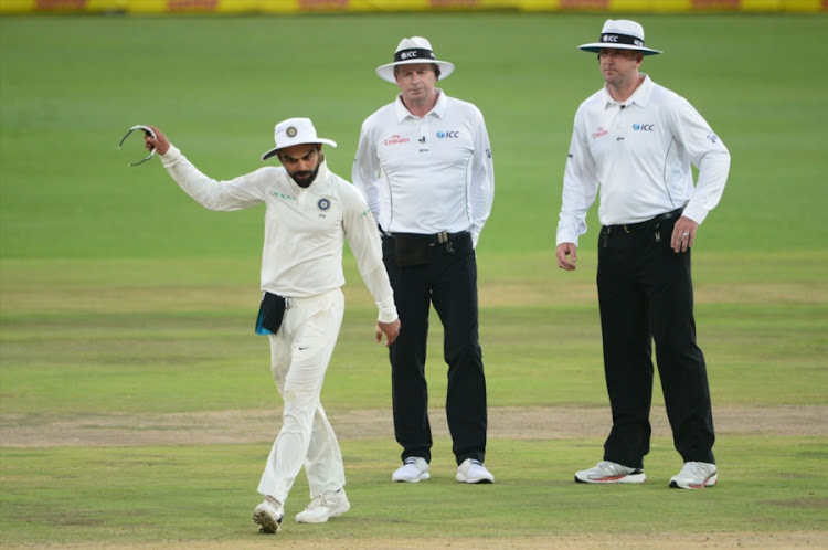 Virat Kohli of India up set with the umpires for stopping play due to bad light during day 3 of the 2nd Sunfoil Test match between South Africa and India at SuperSport Park on January 15, 2018 in Pretoria, South Africa.