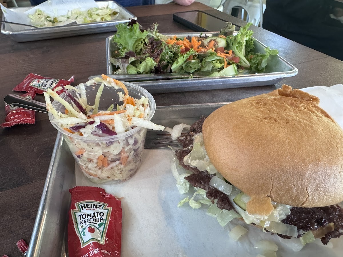 Buddy burger with a gluten-free bun and a side of coleslaw. Heads up, the bun is overpowering with the amount of of meat. Highly recommend you just skip the bun and get the burger without it.