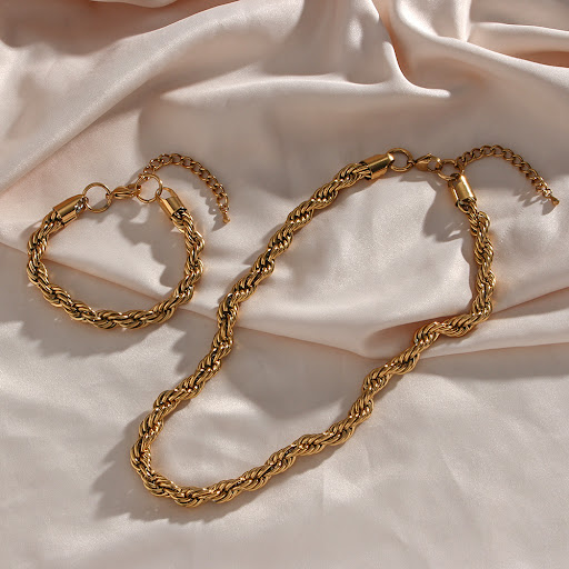 Title 4, Mila Golden Twist Necklace A golden twist to el...