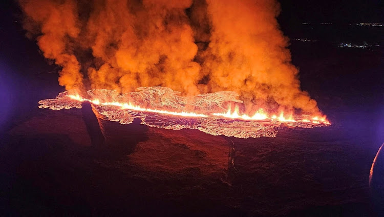 A volcano spews lava and smoke as it erupts in Reykjanes Peninsula, Iceland, on January 14 2024.