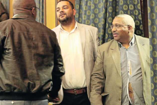 Councillors Neville Higgins and Trevor Louw, right, in the torn shirt