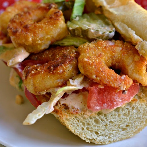 A taste bud awakening Louisiana style Shrimp Po Boy with extra crispy Cajun fried shrimp drizzled with a sassy remoulade sauce.   This satisfying sandwich is sure to be a hit with your family.