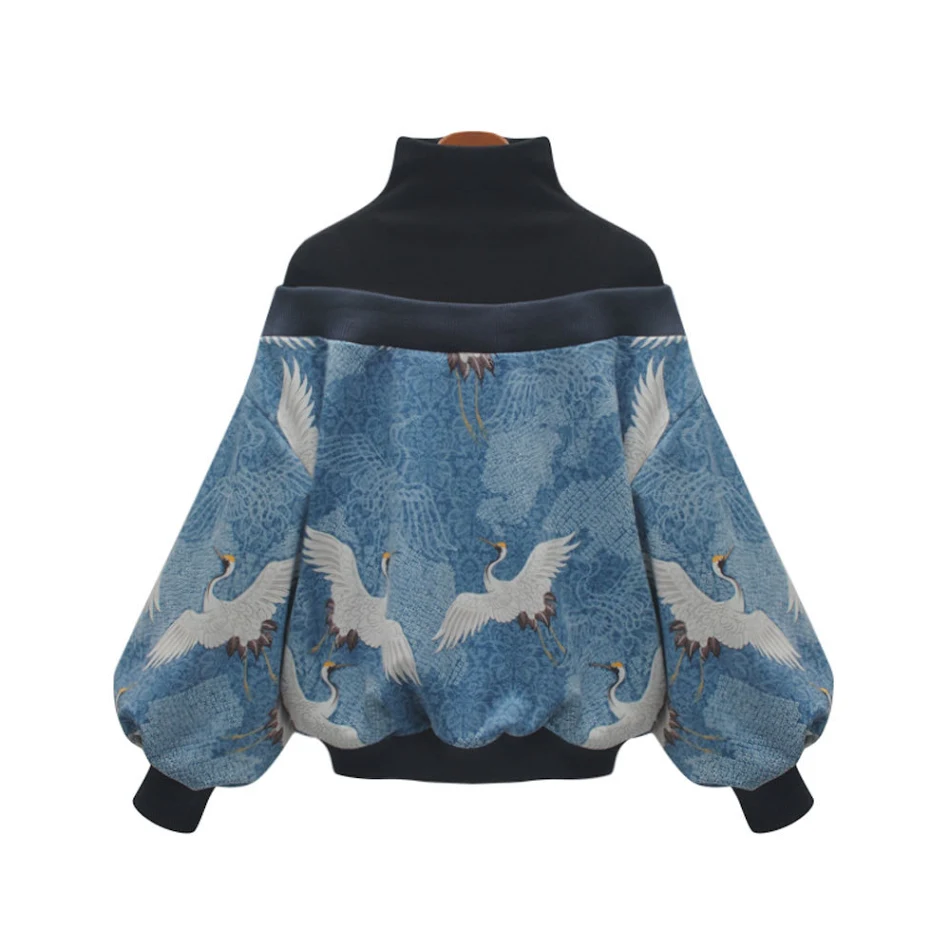 Women's blue patterned high-neck fake two-piece sweater with black stitching. Comfortable and stylish for everyday wear.