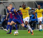 Hlompho Kekana (c) of Mamelodi Sundowns shields the ball from A. Iniesta (c) of Barcelona during the International Club Friendly match between Mamelodi Sundowns and Barcelona FC at FNB Stadium on May 16, 2018 in Johannesburg, South Africa. 