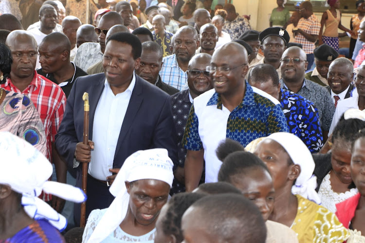 Defense CS Eugene Wamalwa and governor Wangamati during a church service at PEFA church.