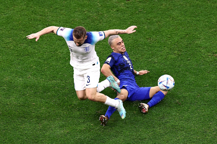 Sergino Dest of United States battles for possession with Luke Shaw of England during the FIFA World Cup Qatar 2022 Group B match at Al Bayt Stadium on November 25, 2022 in Al Khor, Qatar.