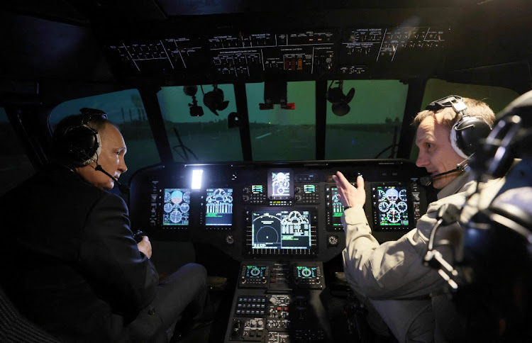 Russian President Vladimir Putin is seen inside a cabin of helicopter simulator training as he visits aviation plant in Ulan-Ude, Buryatia republic, Russia, March 14 2023. Picture: SPUTNIK/REUTERS