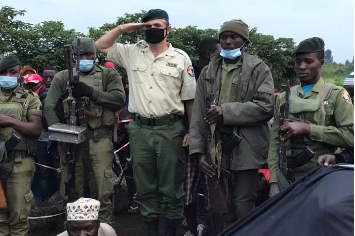 Virunga National Park Rangers and Park director Emmanuel Demerode salutes as they attend the burial of Burhani Abdou Surumwe, a ranger killed in an ambush in Virunga National Park, a sanctuary for endangered mountain gorillas, in Goma, eastern Democratic Republic of Congo on January 11 2021.