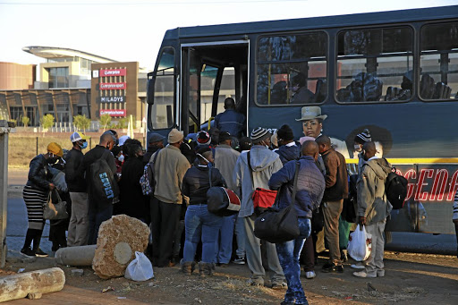 Commuters in Mamelodi, Tshwane, press forward to be among those allowed to board a bus that will be filled to less than capacity as transport authorities adhere to social-distancing protocols.