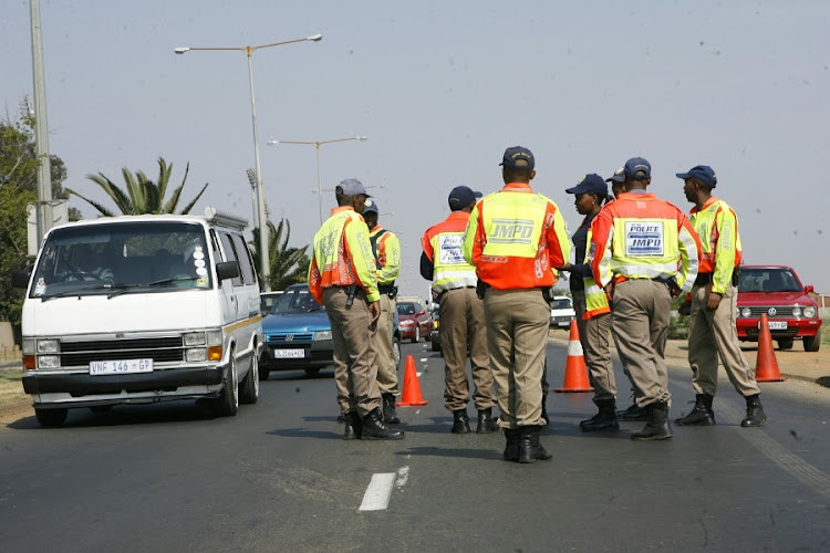 FURORE: Metro police conduct a road block on Chris Hani Road in Soweto. Fines in Gauteng are much lower than in the Western Cape, where many fines have been doubled and trebled. Picture: SOWETAN