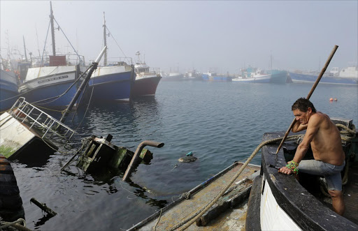 FILE PICTURE: November 17, 2015. CROWDED: From the deck of his trawler, Philip Rice overlooks one of the 13 wrecks in Hout Bay harbour. Pic:Ruvan Boshoff. © Sunday Times