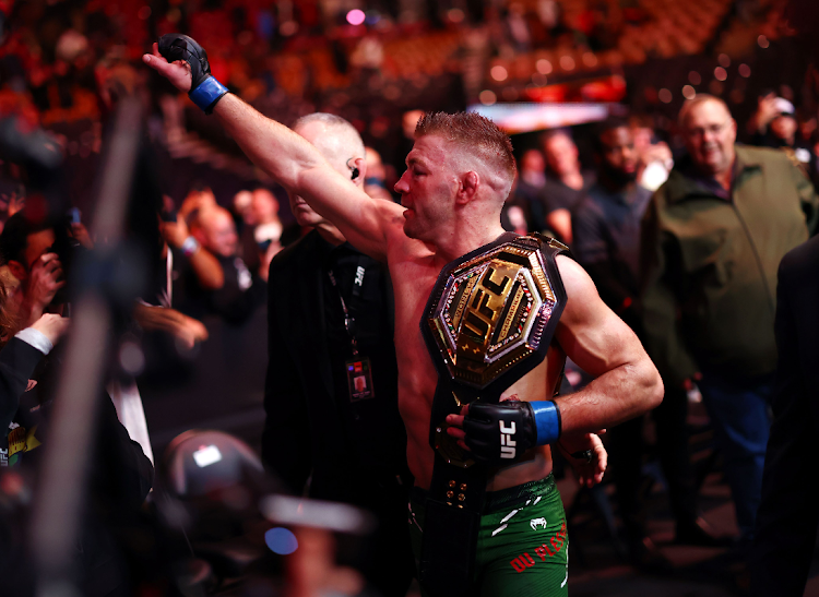 South Africa's Dricus Du Plessis celebrates with the middleweight title belt following his win over Sean Strickland of the United States during the UFC 297 event at Scotiabank Arena on January 20, 2024 in Toronto, Ontario, Canada.