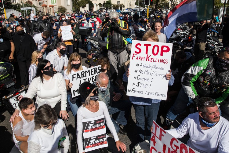 Hundreds of people, many on motorbikes, protested outside Parliament on Saturday morning against farm murders.