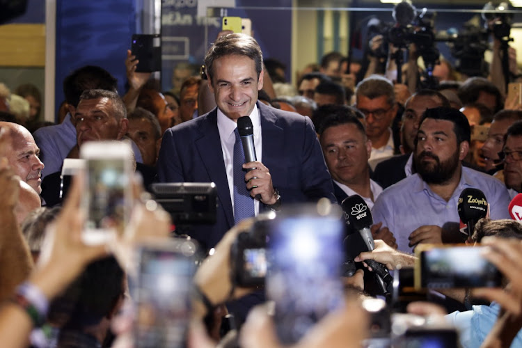 Kyriakos Mitsotakis greets supporters after winning the parliamentary elections at the New Democracy headquarters in Athens, Greece, July 7, 2019. Picture: MILOS BACANSKI/GETTY IMAGES