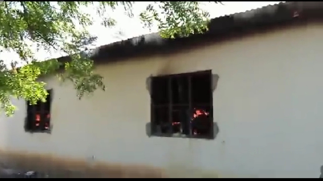Flames of fire are seen in a dormitory at Waa Boys High School, Kwale on November 27, 2021