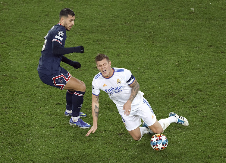 Real Madrid's Toni Kroos in action with Paris St Germain's Leandro Paredes