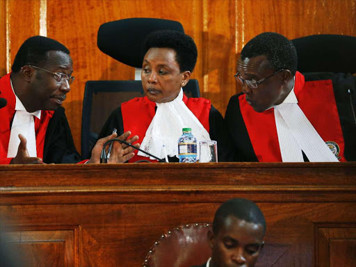 Chief Justice David Maraga consults Deputy Philomena Mwilu and justice Smokin Wanjala during the status conference of the presidential election petition, November 14, 2017. /JACK OWUOR