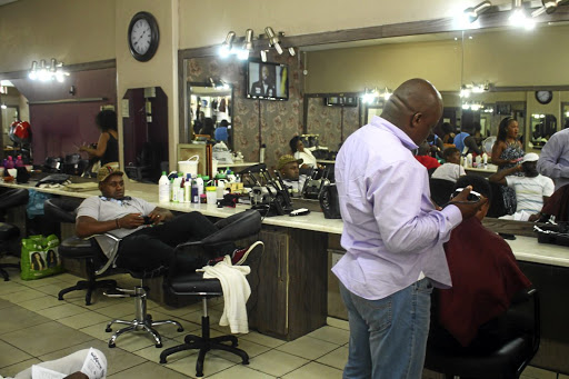 A doctor who works at a hair salon has been battling to find a job and has been working at the salon run by his wife in Pretoria.