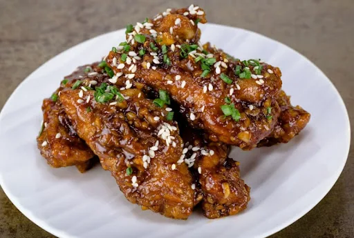 Chicken Wings In Schezwan Sauce( 8 Pc)