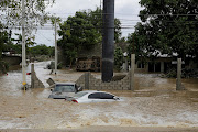 Submerged cars are pictured at an area affected by floods after the passage of Storm Eta, in El Progreso, Honduras November 6, 2020. 
