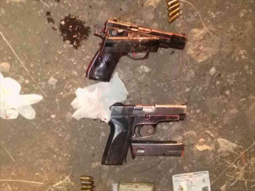 The pistols and bullets recovered after police shot the suspected robbers on Mombasa Road yesterday / COURTESY