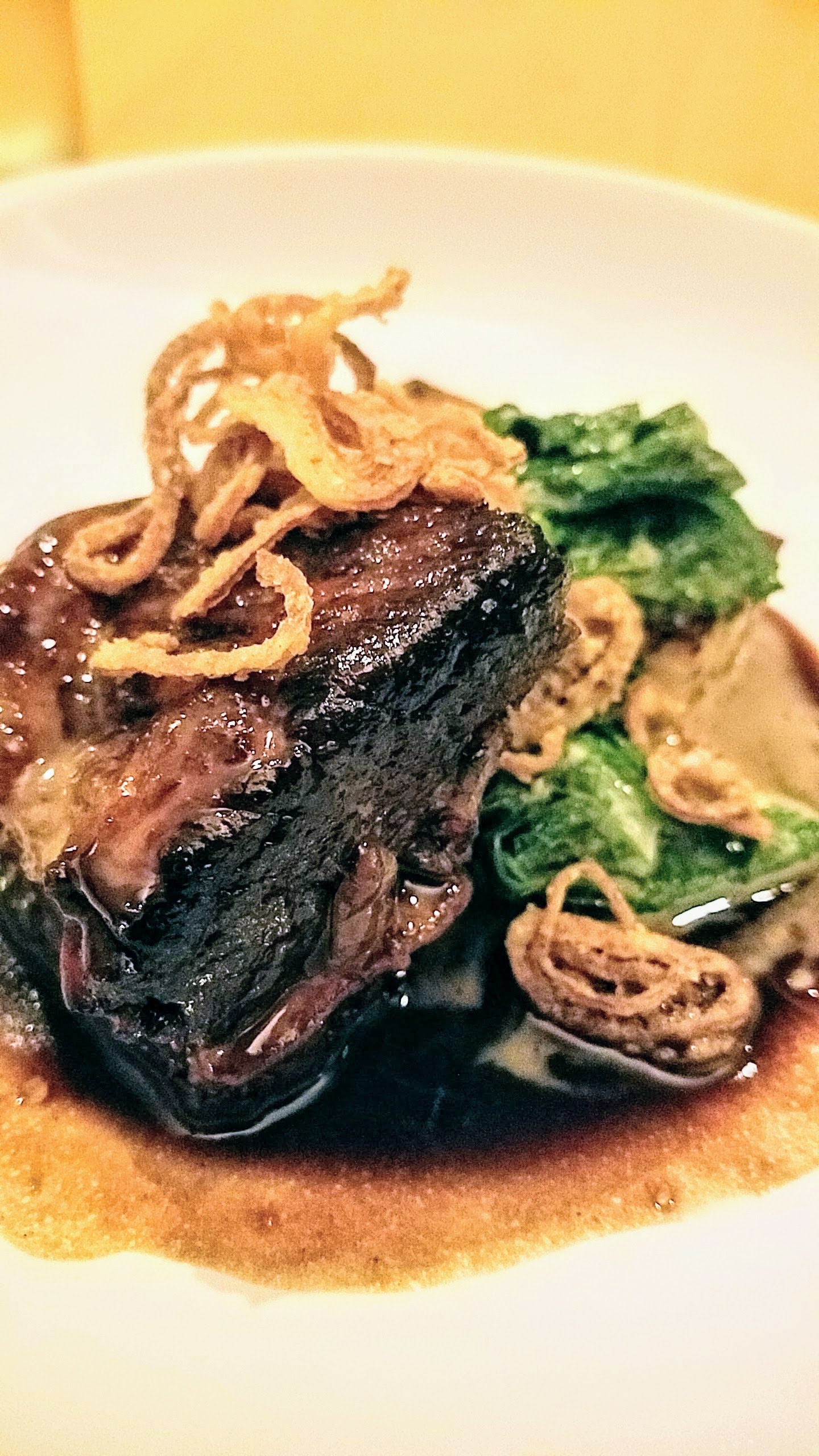 Portland Dining Month item from Aviary of Hoisin-glazed beef short rib with turnip cake, bacon, mustard greens and fried shallots