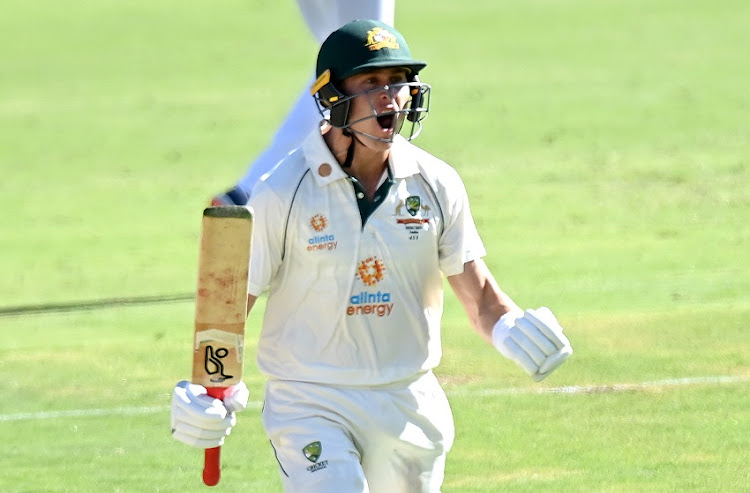 Marnus Labuschagne of Australia celebrates scoring a century during day one of the 4th Test Match in the series between Australia and India at The Gabba on January 15, 2021 in Brisbane, Australia.