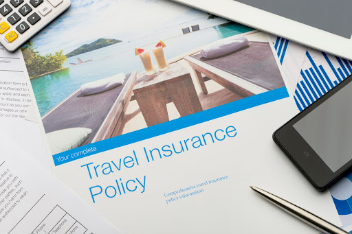 Travel insurance policy document with paperwork