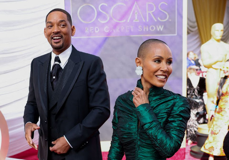 Will Smith and Jada Pinkett Smith pose on the red carpet during the Oscars arrivals at the 94th Academy Awards in Hollywood, Los Angeles, California, U.S., March 27, 2022.
