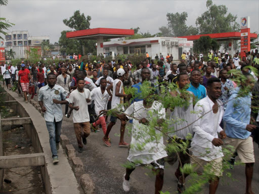 Congolese opposition supporters chant slogans during a march to press President Joseph Kabila to step down in the Democratic Republic of Congo's capital Kinshasa, September 19, 2016. /REUTERS