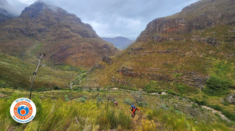 Rescue teams hiking up into the remote Wemmershoek mountains, between Paarl and Franschhoek, on Monday morning.