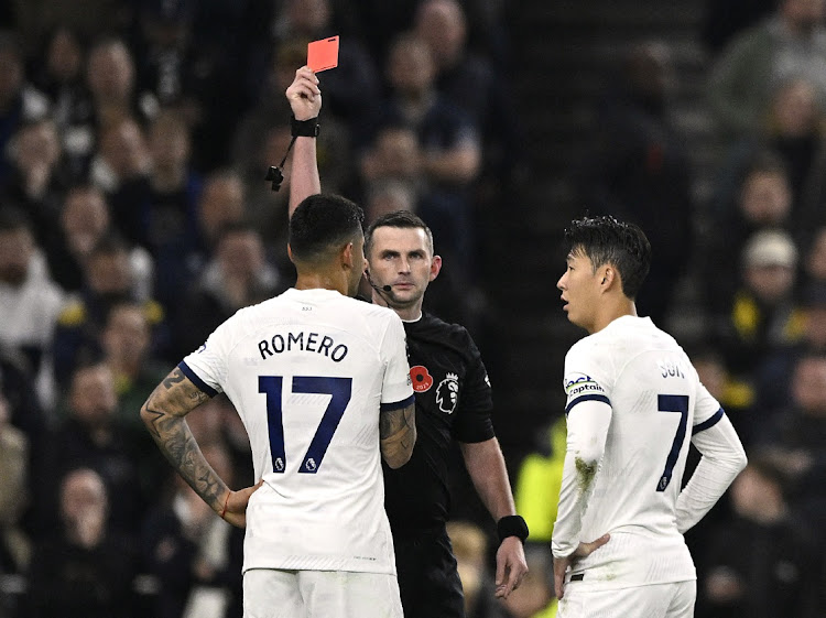 Tottenham Hotspur's Cristian Romero is shown a red card by referee Michael Oliver during their match against Chelsea at Tottenham Hotspur Stadium in London, Britain, on November 6 2023. Picure: TONY OBRIEN/REUTERS