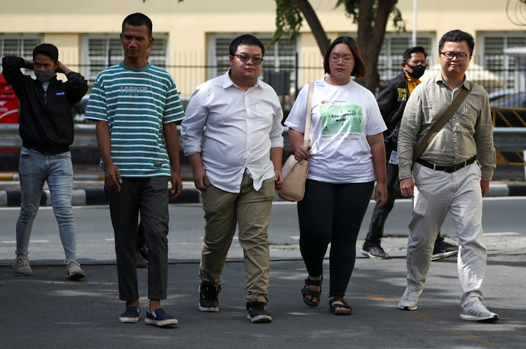 Panupong "Mike Rayong" Jadnok, Parit "Penguin" Chiwarak, Panusaya "Rung" Sithijirawattanakul and Arnon Nampa, a rights lawyer and protest leader arrive to report themselves to police summons to acknowledge additional charges of Article 112 for actions deemed as insult to the monarchy, at a police station in Bangkok in this November 30 2020 file photo. Picture: REUTERS/ATHIT PERAWONGMETHA