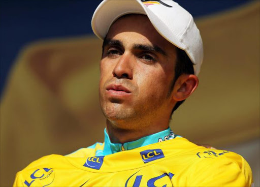 Race leader Alberto Contador of team Astana stands on the podium in the yellow jersey following stage 19 of the Tour de France on July 24, 2010 in Pauillac, France. The only time-trial stage of this yearÍs race, the 52km course started in Bordeaux and finished in Pauillac. Fabian Cancellara of team Saxo Bank won the stage. The iconic bicycle race will include a total of 20 stages and will cover 3,642km before concluding in Paris on July 25