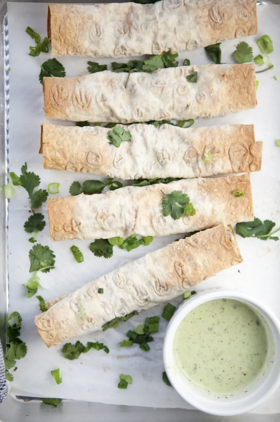 Crunchy taquitos with sauce that are the perfect idea for macro-friendly brunch.  Lillieeatsandtells.com 