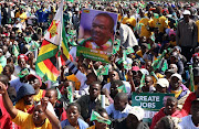 Supporters of President Emmerson Mnangagwa gather at an election rally in Marondera, Zimbabwe, July 21, 2018. 