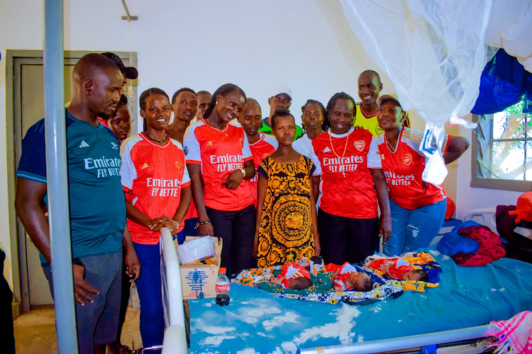 Arsenal supporters visit a mother who gave birth to triplets to donate items at Kakuma Mission Hospital in Turkana West/HESBORN ETYANG