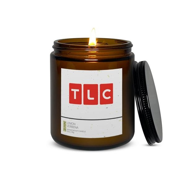 a candle with promotional branding on the label