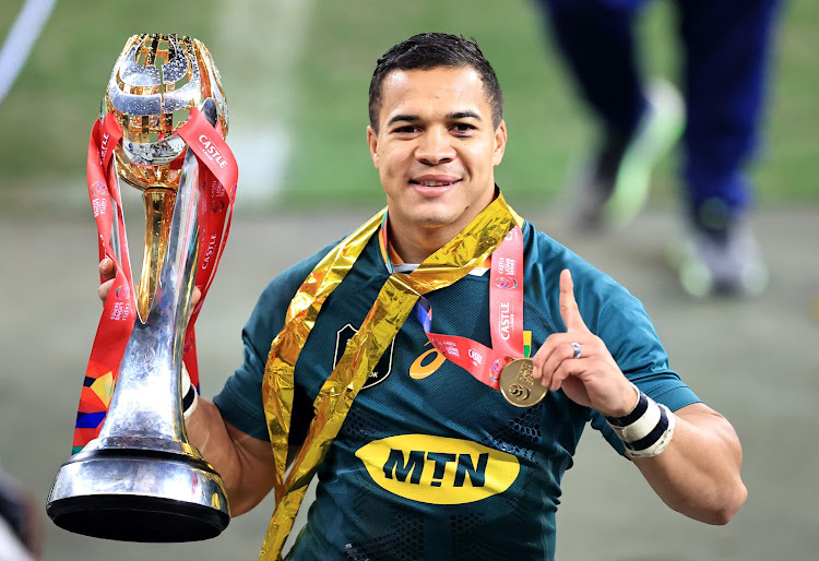 Cheslin Kolbe, a man for the big occasion, poses with the British & Irish Lions Trophy.