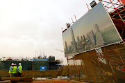 Chinese construction labourers work at the site of the future Iconic Tower skyscraper in the New Administrative Capital (NAC) east of Cairo, Egypt, in May 2019. 