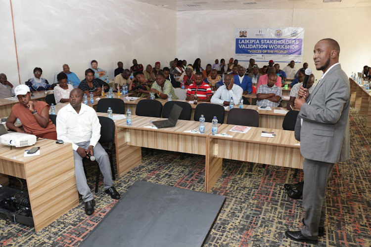 Interpeace country representative Hassan Ismail addressing a past peace meeting in Laikipia