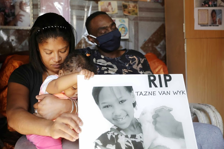 Tazne van Wyk's mother Carmen and father Terence Manuel during a prayer at their Elsies River home in Cape Town. File photo.