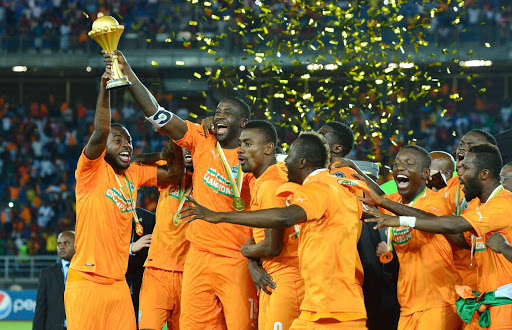 Yaya Toure (3-L) of Ivory Coast holds aloft the trophy after the 2015 Africa Cup of Nations final soccer match between Ivory Coast and Ghana at the Bata Stadium in Equatorial Guinea. Picture: EPA