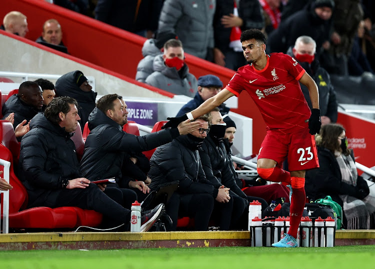 Luis Diaz of Liverpool is congratulated by the bench after being substituted during the Premier League match against Leicester City at Anfield in Liverpool on February 10 2022.