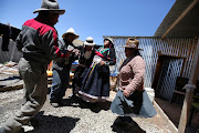 Monica Lima (2nd R) and friends gather at her house days after her wedding in the town of Nueva Fuerabamba in Apurimac, Peru, October 3, 2017. 