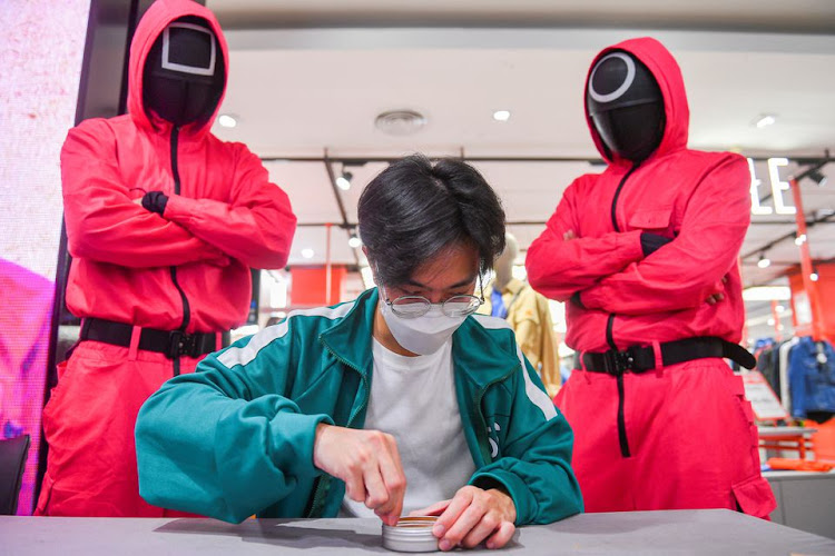 A man participates in a Netflix series 'Squid Game' mission at a department store in Bangkok, Thailand, November 20, 2021.