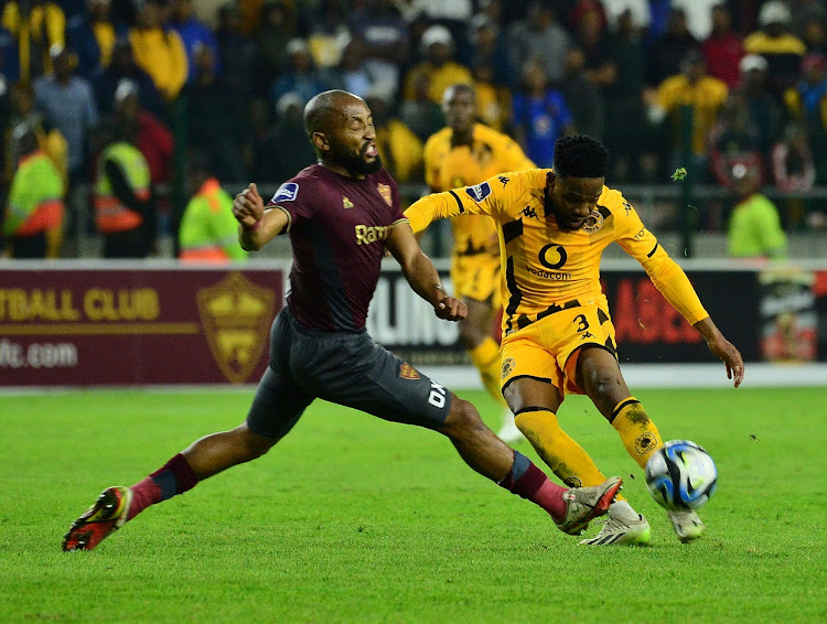 Sibongiseni Mthethwa of Stellenbosch FC attempts to block a shot from Mduduzi Mdantsane of Kaizer Chiefs in their DStv Premiership clash at Athlone Stadium on August 30.