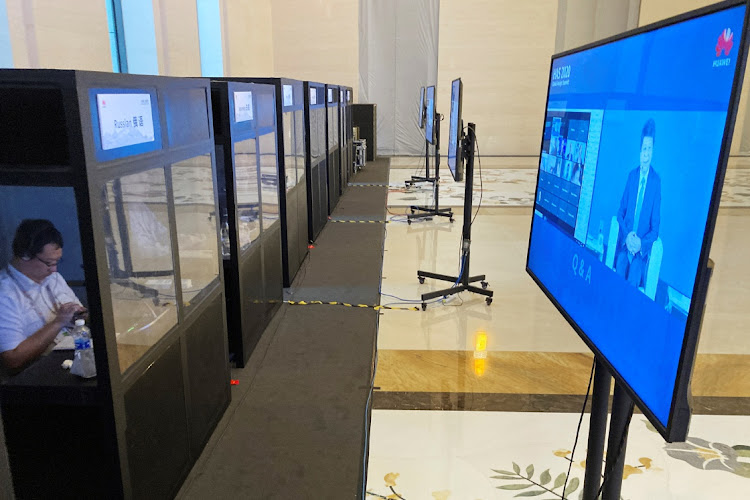 Interpreters listen inside their booths as Huawei Technologies chair Guo Ping speaks in Shenzhen, Guangdong province, China, May 18 2020. Picture: REUTERS/MARTIN POLLARD